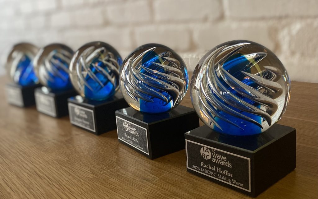 Five Wave awards are lined up in a row